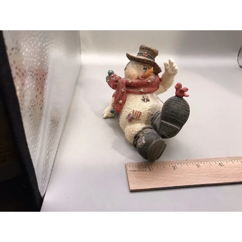 Resin Snowman Kicked‎ Back With A Bird On His Foot
